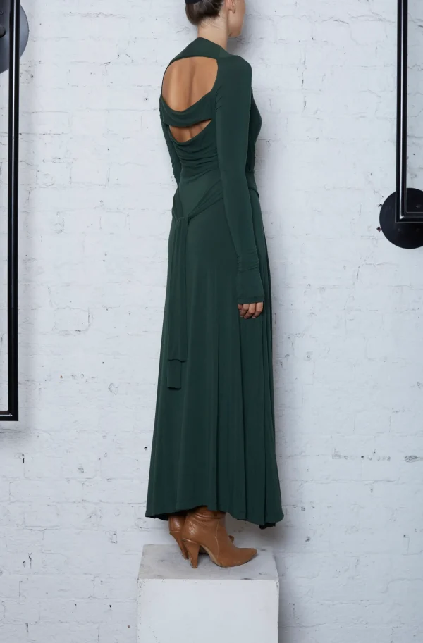 woman wearing a green long dress with brown boots